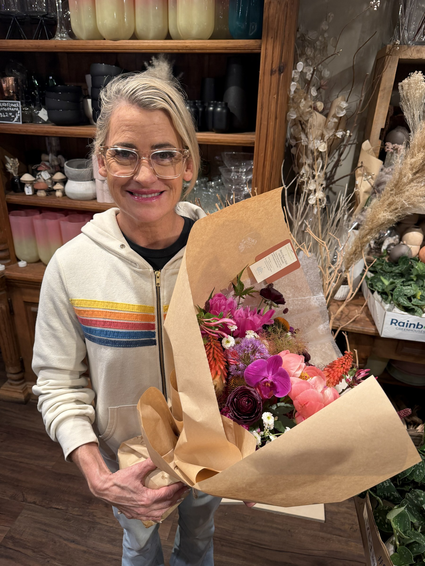 Deb holding her newly gathered wedding bouquet