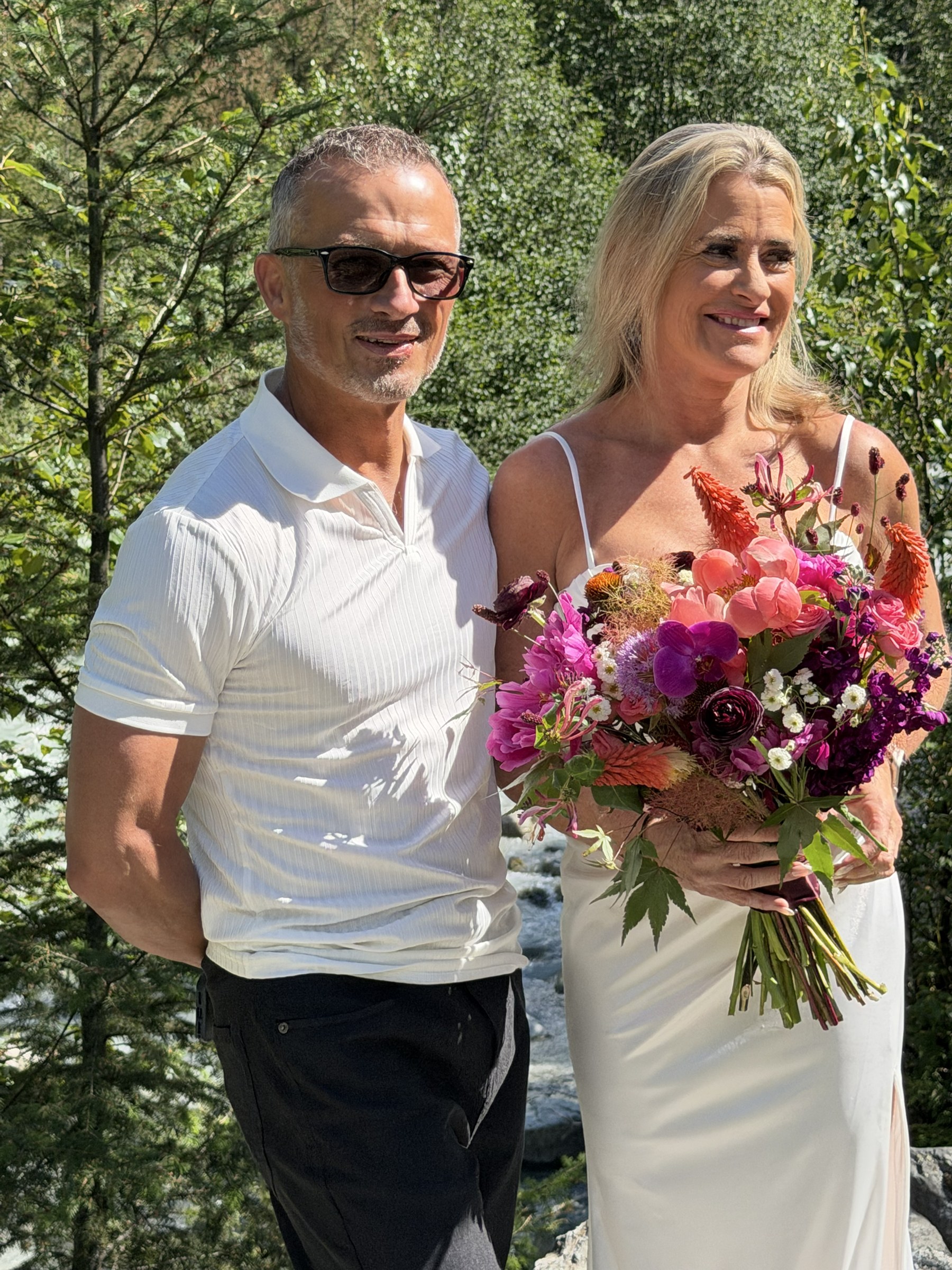 Deb and Daryl posing with the bouquet