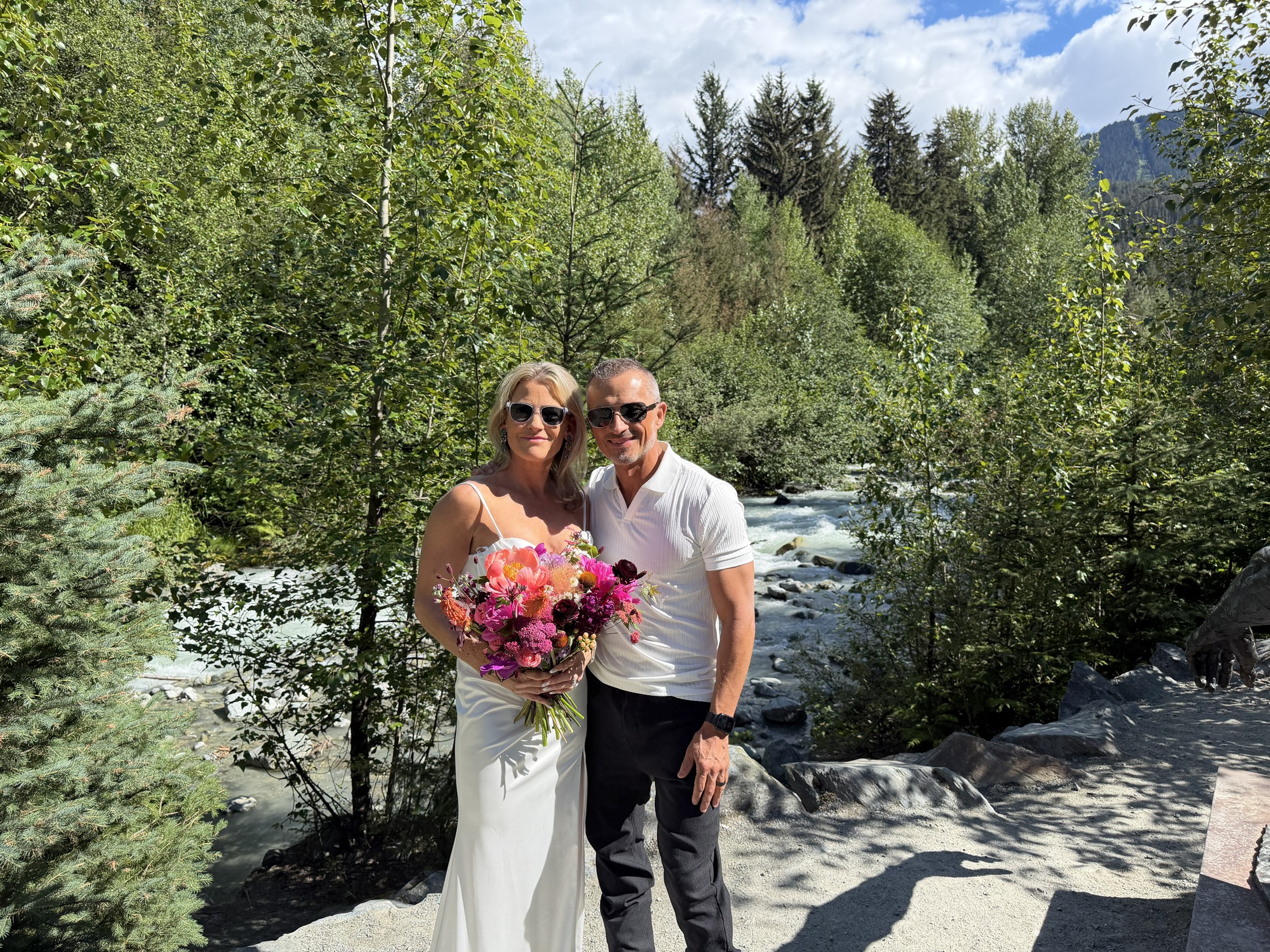 Deb and Daryl beside the rushing river