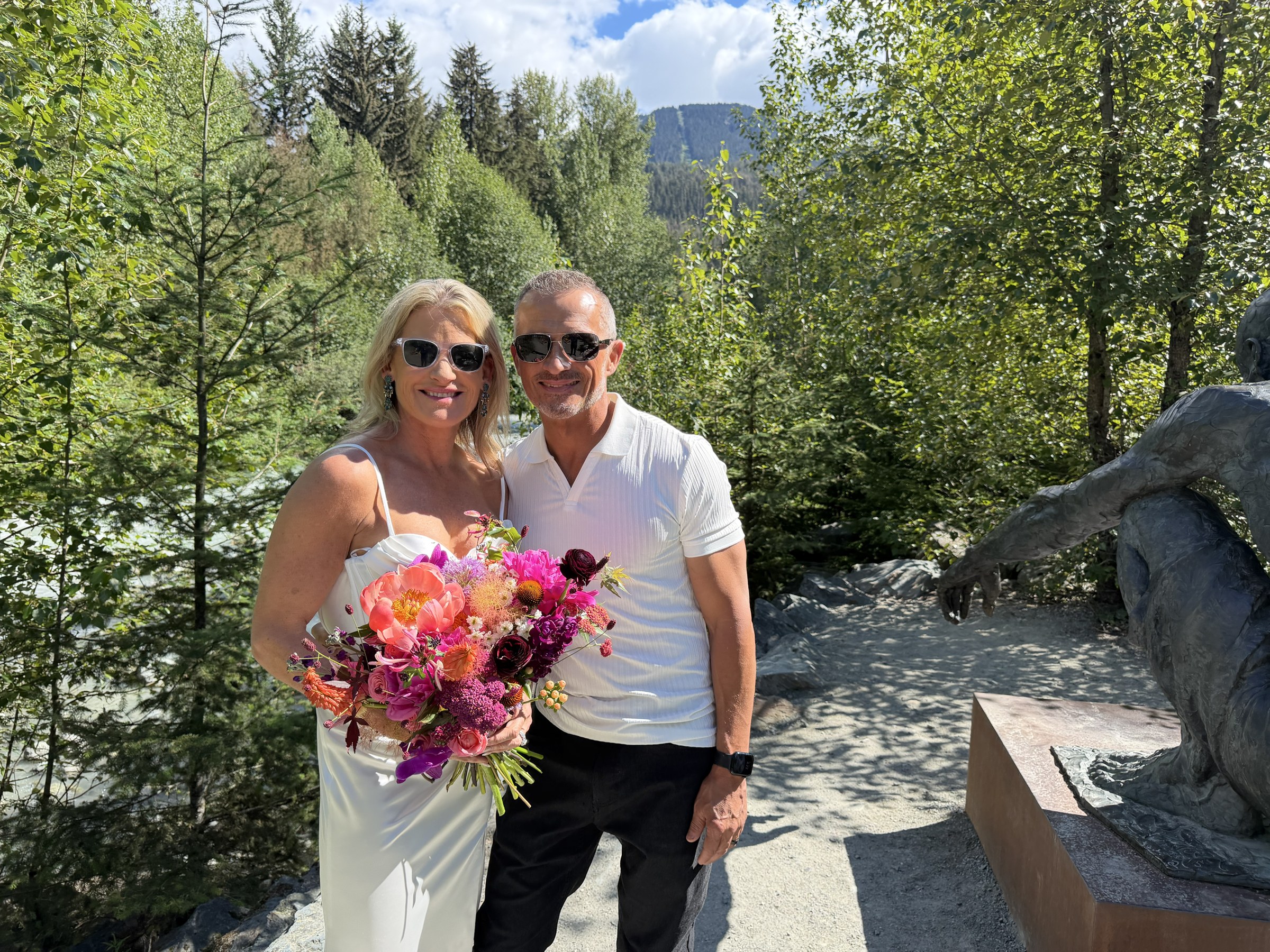 Deb and Daryl smiling in the mountain sunshine